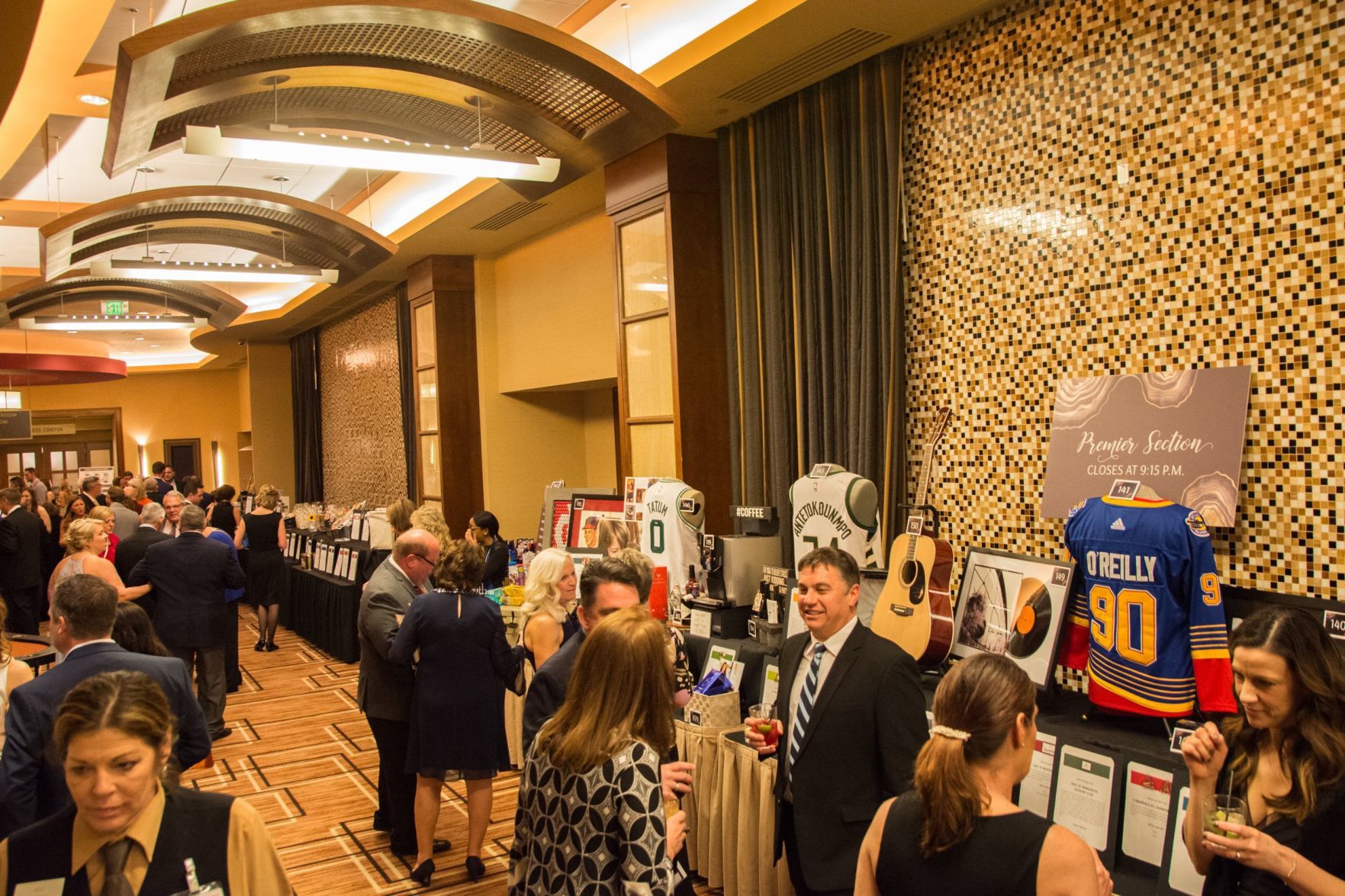Guests mingle in the auction area